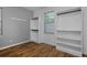 Bedroom closet featuring custom shelving, rods and natural light at 1735 Crestone Dr, Longmont, CO 80504