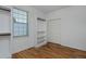 Bright, open closet with custom shelves and rods, laminate flooring at 1735 Crestone Dr, Longmont, CO 80504