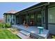 Charming covered patio with comfortable seating and elegant decor, perfect for enjoying the outdoors in style at 1735 Crestone Dr, Longmont, CO 80504