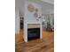 Charming fireplace with tile surround, seamlessly connected to a dining area and kitchen at 1735 Crestone Dr, Longmont, CO 80504