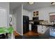 Spacious kitchen boasts stainless steel appliances, granite counters, and white cabinetry at 1735 Crestone Dr, Longmont, CO 80504