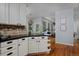 Kitchen cabinets with black granite and backsplash, located off a dining area at 1735 Crestone Dr, Longmont, CO 80504