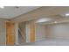 Finished basement with multiple closets, wood doors, and stairs provides additional space for you at 1735 Crestone Dr, Longmont, CO 80504
