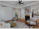 Open-concept living room with fireplace, stylish seating, and a view into the kitchen at 1735 Crestone Dr, Longmont, CO 80504