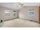 Large primary bedroom with neutral carpeting, vaulted ceiling, and ample natural light at 6202 Ralston St, Frederick, CO 80530