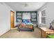 Bright bedroom featuring built-in shelving, a ceiling fan, and a carpeted floor at 6202 Ralston St, Frederick, CO 80530