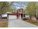 Charming two-story home with a well-manicured lawn and inviting front porch at 6202 Ralston St, Frederick, CO 80530