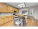 Open concept kitchen with stainless steel appliances and an adjacent dining area at 6202 Ralston St, Frederick, CO 80530