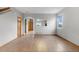 Bright living room featuring hardwood floors, a neutral color scheme, and an open layout at 6202 Ralston St, Frederick, CO 80530