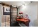 Finished basement featuring a stylish sliding barn door and adjacent home theater snack station at 7790 Kendall St, Arvada, CO 80003