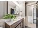 Well-lit bathroom features a modern vanity with a white countertop and contemporary mirror at 7790 Kendall St, Arvada, CO 80003