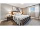 Cozy bedroom with a large bed, soft lighting, and neutral colors providing a peaceful and relaxing atmosphere at 7790 Kendall St, Arvada, CO 80003