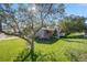 Well-maintained lawn surrounds this charming home, enhanced by mature trees at 7790 Kendall St, Arvada, CO 80003