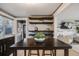 Kitchen and dining area with a large table and seating featuring seamless view into living room at 7790 Kendall St, Arvada, CO 80003