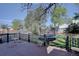 Wonderful backyard featuring a wood deck, lush greenery, and a fun trampoline at 8745 W Ottawa Ave, Littleton, CO 80128