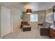 Finished basement featuring carpet, neutral colors, and a comfortable seating area at 8745 W Ottawa Ave, Littleton, CO 80128