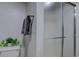 Clean bathroom showcasing a glass shower door, gray towels, and modern fixtures at 8745 W Ottawa Ave, Littleton, CO 80128