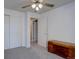 Bedroom featuring closet doors, carpet, and a cedar chest at 8745 W Ottawa Ave, Littleton, CO 80128