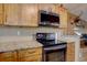 Eat in kitchen featuring granite countertops and stainless steel appliances at 8745 W Ottawa Ave, Littleton, CO 80128