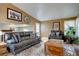 Comfortable living room area, great for entertaining with stylish furniture and decor at 8745 W Ottawa Ave, Littleton, CO 80128