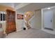 Comfortable living room with carpeted floors, a staircase, and a wooden hutch at 8745 W Ottawa Ave, Littleton, CO 80128