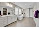 Bright bathroom features double vanities, soaking tub, walk-in shower, and tile flooring at 6912 Sunstrand Ct, Castle Pines, CO 80108