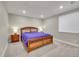 Comfortable bedroom featuring a wood-frame bed and soft, neutral decor for a relaxing ambiance at 6912 Sunstrand Ct, Castle Pines, CO 80108