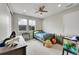 Bedroom with large windows offering natural light, and a ceiling fan at 6912 Sunstrand Ct, Castle Pines, CO 80108