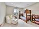 ' bedroom with a fun bunk bed, cozy chair, and playful decor at 6912 Sunstrand Ct, Castle Pines, CO 80108