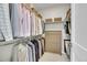 Walk-in closet featuring custom organization system and ample storage space at 6912 Sunstrand Ct, Castle Pines, CO 80108
