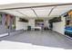 Well-organized garage space with slatwall storage, overhead racks, and epoxy flooring at 6912 Sunstrand Ct, Castle Pines, CO 80108