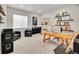 Stylish home office with guitars, ample desk space, and comfortable seating at 6912 Sunstrand Ct, Castle Pines, CO 80108