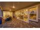Outdoor patio with ample seating and large glass doors opening to the home's interior at 6912 Sunstrand Ct, Castle Pines, CO 80108