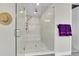 Modern glass shower with a mosaic tile accent wall and bench seating at 6912 Sunstrand Ct, Castle Pines, CO 80108