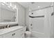 Clean bathroom featuring a tub shower, vanity and neutral wall color at 6393 Laguna Cir, Highlands Ranch, CO 80130