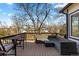 Outdoor deck area with comfortable seating and views of the neighborhood and mature trees at 6393 Laguna Cir, Highlands Ranch, CO 80130