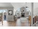 Spacious living room with vaulted ceilings, hardwood floors, fireplace, and access to a deck at 6393 Laguna Cir, Highlands Ranch, CO 80130