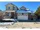 Two-story house with a large front yard, two-car garage, and basketball hoop at 2835 S Jebel Way, Aurora, CO 80013