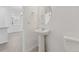 A pedestal sink is featured in this half-bathroom at 18708 E 99Th Ave, Commerce City, CO 80022