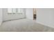 Bedroom featuring neutral carpet, large windows, and closet access at 18708 E 99Th Ave, Commerce City, CO 80022