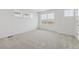 Spacious, bright bedroom with neutral carpet and large windows offering scenic views at 18708 E 99Th Ave, Commerce City, CO 80022
