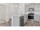 Well-equipped kitchen with stainless dishwasher, gas range and granite countertops at 18708 E 99Th Ave, Commerce City, CO 80022