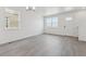 Open floor plan with luxury vinyl plank flooring and lots of natural light at 18708 E 99Th Ave, Commerce City, CO 80022