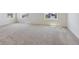 Large bedroom with neutral carpet and large windows providing plenty of light at 1923 Westport Ave, Berthoud, CO 80513