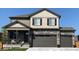 Inviting two-story home with a covered front porch and a three-car garage at 1923 Westport Ave, Berthoud, CO 80513