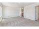 A spacious living room featuring neutral walls and carpet flooring, ready for personalization at 1923 Westport Ave, Berthoud, CO 80513