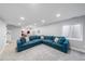 Open basement layout featuring a comfortable sectional sofa and wet bar area, perfect for entertaining guests at 2153 Mountain Iris Dr, Erie, CO 80516