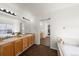 Bright bathroom features dual sinks, soaking tub, and plenty of counter space at 2153 Mountain Iris Dr, Erie, CO 80516