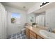 A full bathroom with modern fixtures, a neutral color scheme, and a well-lit vanity area at 2153 Mountain Iris Dr, Erie, CO 80516