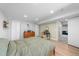 Spacious bedroom with wood-look flooring, closet space, and convenient access to the living area in the basement at 2153 Mountain Iris Dr, Erie, CO 80516